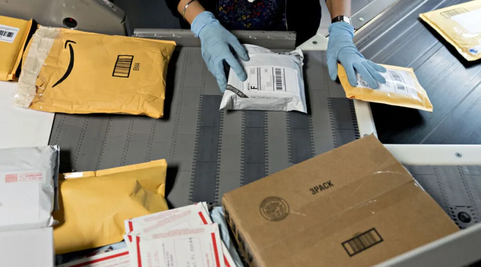 Parcels moving through a delivery sorting facility